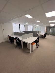 After sustainable rehabilitation with repurposed materials in a modern office setting"