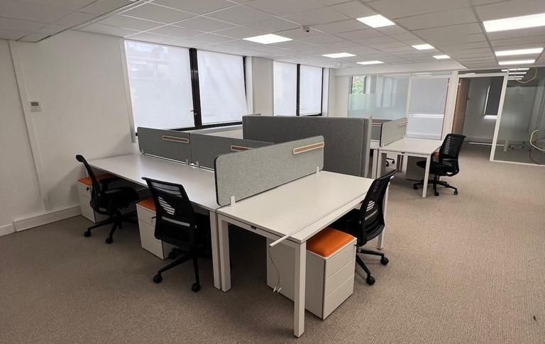 After sustainable rehabilitation with repurposed materials in a modern office setting"