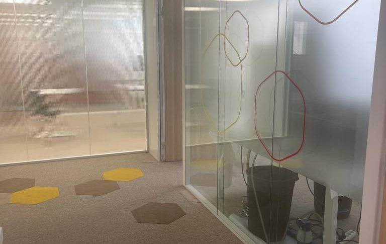 After sustainable rehabilitation with repurposed materials in a modern office setting"