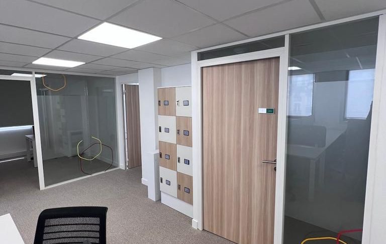 After sustainable rehabilitation with repurposed materials in a modern office setting"