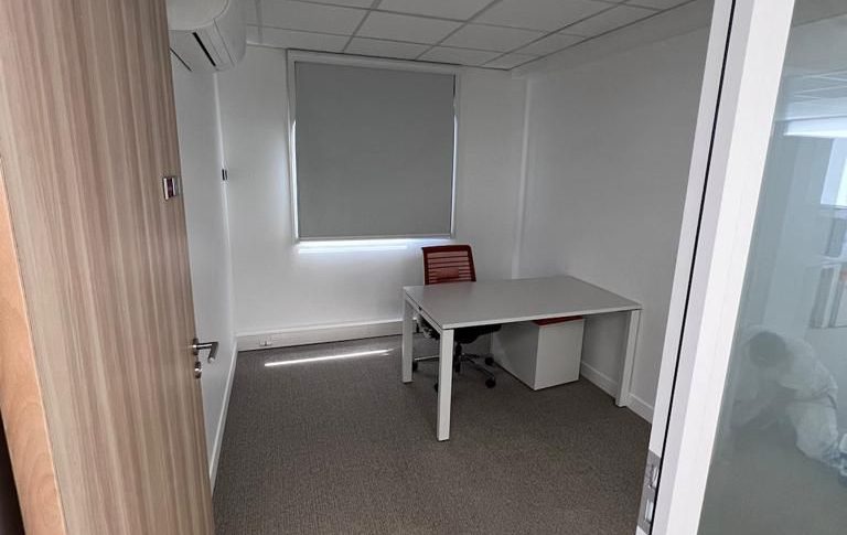 After sustainable rehabilitation with repurposed materials in a modern office setting"